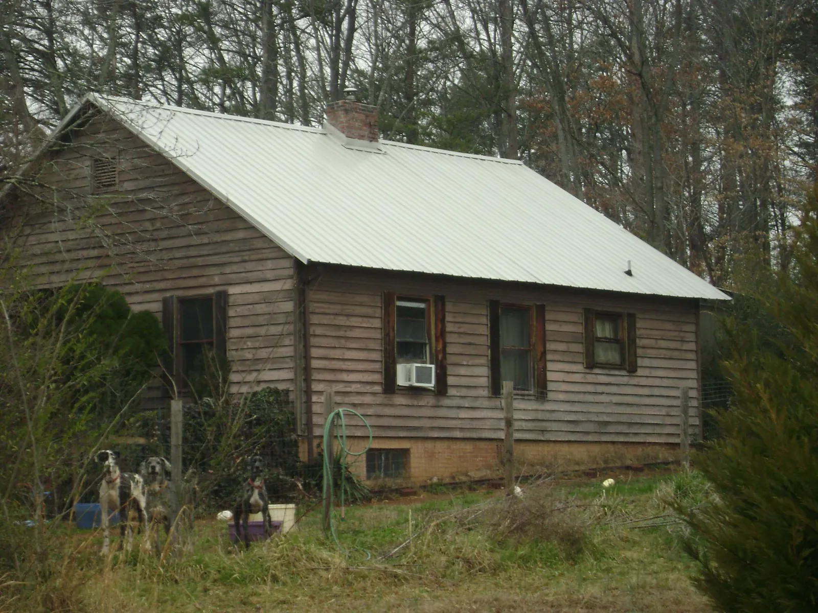 White metal roof on an old wood sided farmhouse, from a Metal Roof Installation job in Lomita